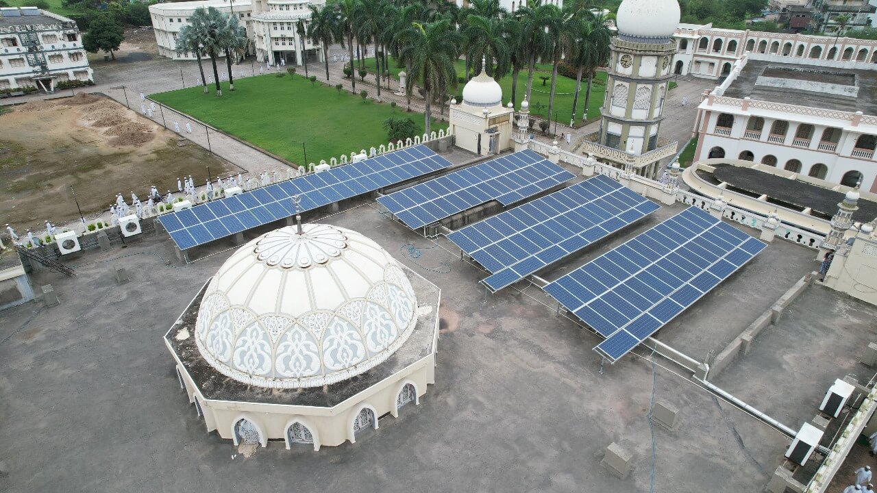 Flat rooftop of Madrasa Jamia Islamia with solar panel arrays