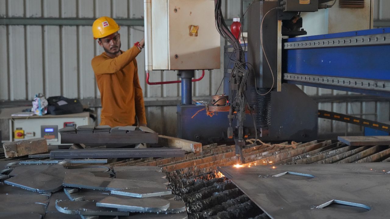 Interior of a KP Green Engineering fabrication plant, showing machinery and steel structures.