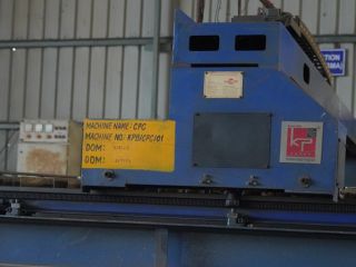Close-up of a CNC machine control unit labeled with machine name and number
