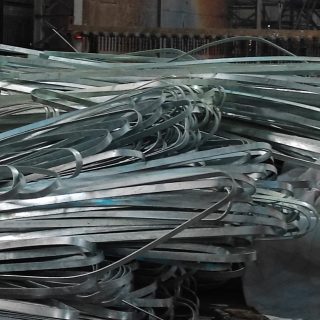 Galvanized Iron (GI) Earthing Strip A coil of galvanized iron (GI) earthing strip used for electrical grounding in industrial applications.