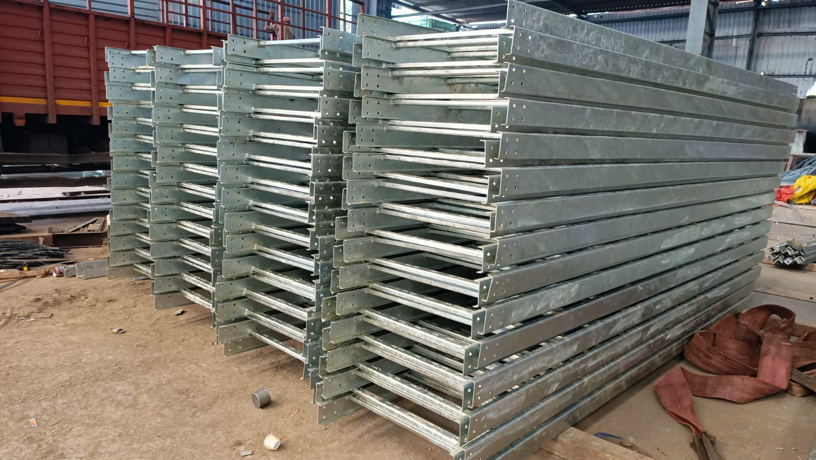 Ladder-Type Cable Tray for Industrial Wiring Industrial ladder-type cable tray with two side rails connected by rungs, supporting heavy-duty electrical wiring.