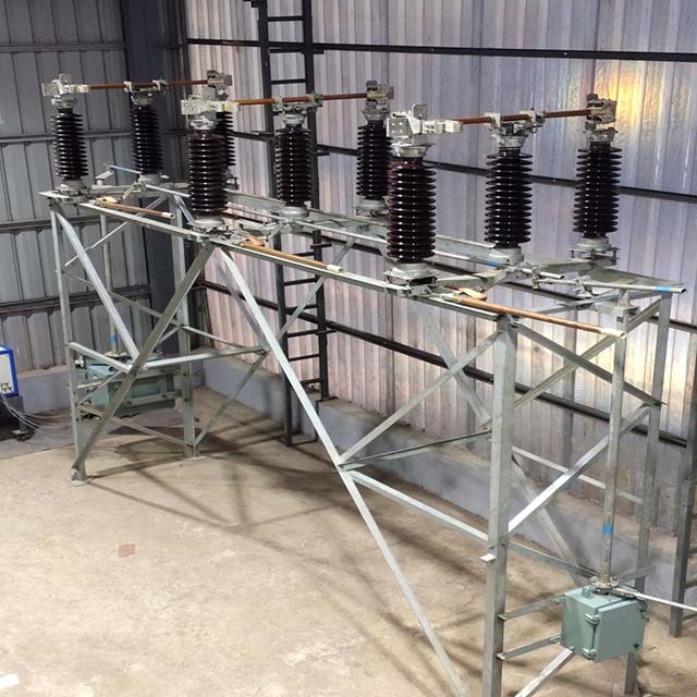 A galvanized steel double break electrical isolator for use in a high-voltage substation.