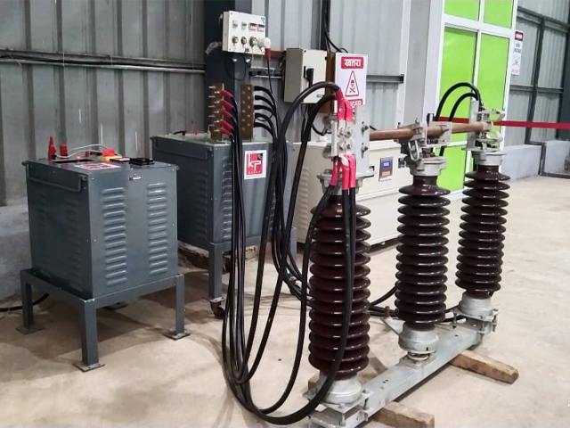 Double Break Electrical Isolator A large, three-post double break electrical isolator used for safety in an electrical substation.